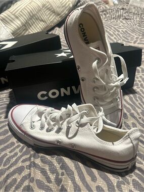 Converse white low top sneakers with red stripe